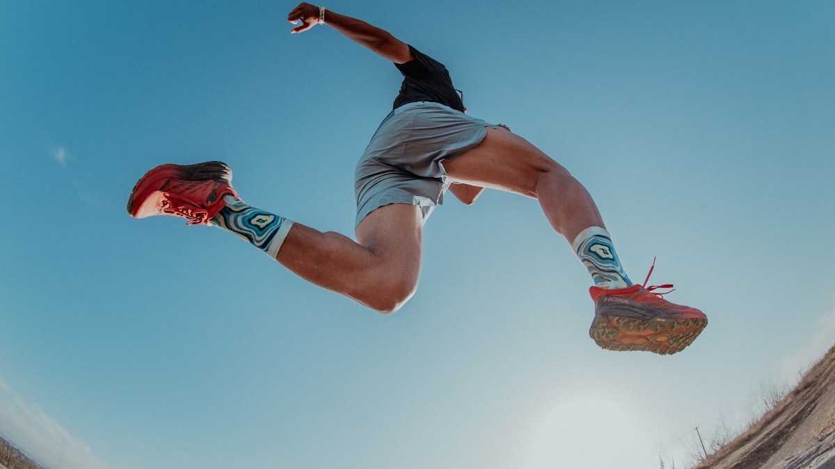 Trail runner about to land on uneven ground &mdash; ankle sprain physical therapy for athletes at Forward Physio Tampa